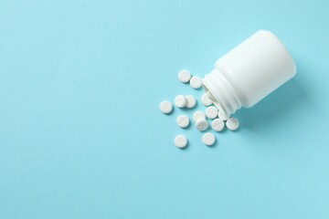 Various medicine pills on color background