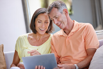 Sofa, mature couple and laughing with tablet for online joke, comedy film and streaming on website....