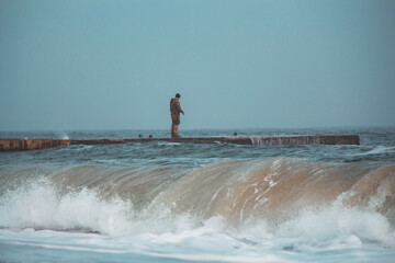 Soldier on Pier in Stormy, Foggy Weather