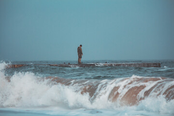 Soldier on Pier in Stormy, Foggy Weather