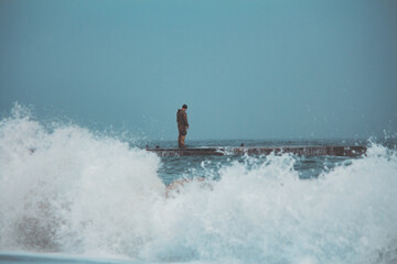 Soldier on Pier in Stormy, Foggy Weather