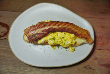 Toasted bread with beacons and scrambled eggs