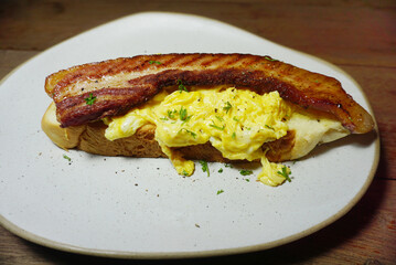 Toasted bread with beacons and scrambled eggs