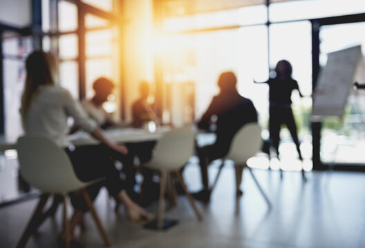 Presentation, blur and workshop with business people in meeting for financial, speaker and company valuation. Investment report, asset management and budget portfolio with employees in office