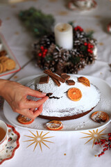 an exquisitely set Christmas table, adorned with elegant decorations and a delightful festive pie as the centerpiece