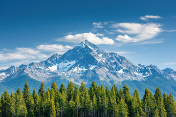 Obraz premium White clouds passing over mountain peaks, Majestic mountain peak rises above lush green forest under a clear blue sky, showcasing stunning natural beauty and tranquility.