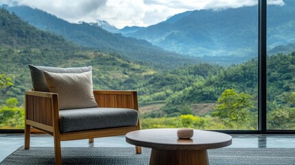 Fototapeta premium Armchair positioned beside a coffee table with a captivating view of mountains and forest in the background, providing a serene atmosphere with ample copy space.
