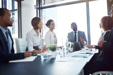 Brainstorming, diversity and meeting with business people in boardroom in office together for planning. Collaboration, conversation or discussion with corporate employee team at table in workplace