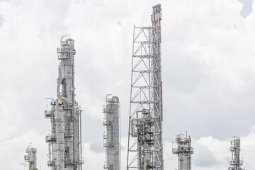 Oil petroleum refinery plant building distillation columns tower, Closeup part of fuel gas pipe complex, Crude oil petrochemical industrial building.