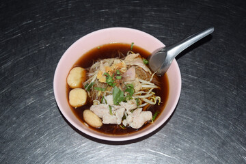 Kao Lao Moo, which is one of street food in Thailand