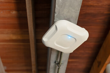 Wireless router for internet local network at ceiling. Indoor networking technology. WIFI router or...