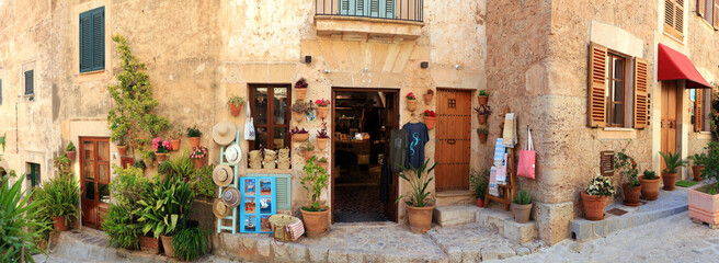 Mallorca (Majorca) island- traditional village Valldemossa with charming floral street decoration and small souvenir shops