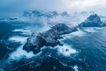 Fototapeta premium A large body of water with snow covered mountains in the background