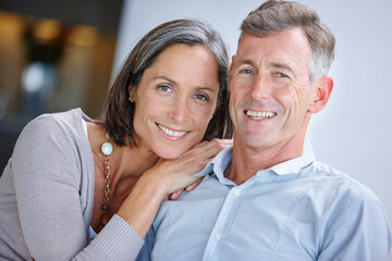 Home, mature couple and portrait with bonding for love, connection and happy in healthy marriage. House, man and woman with embrace for relationship, anniversary and commitment with relax in Canada