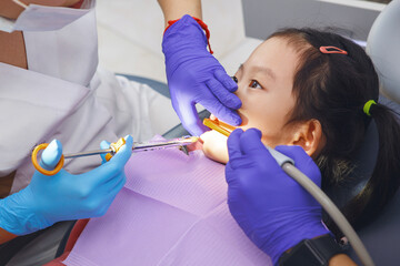 Little Girl Getting Her Teeth Checked by Dentist Before that Gets Dose of Anesthetic Injection