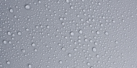 Textured gray background with clear water drops, background for design or text. Top view. Free...