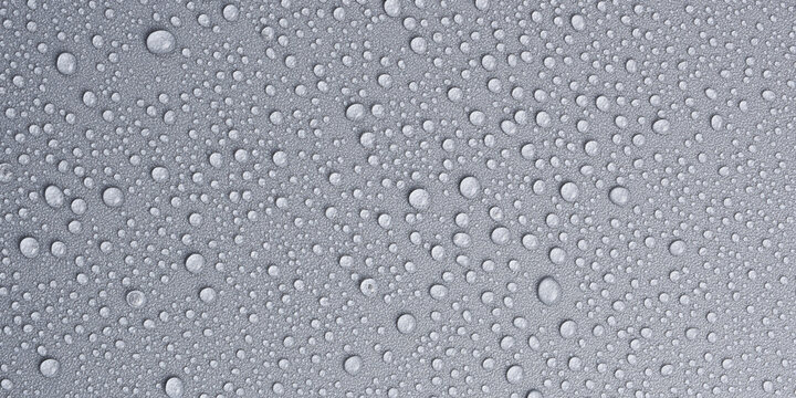 Textured gray background with clear water drops, background for design or text. Top view. Free space.