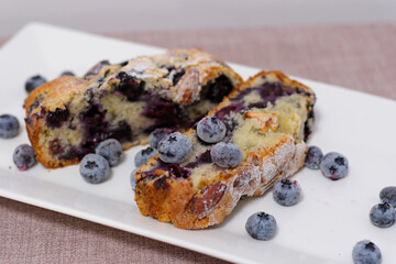 holly berries in pies Pandoro and Panettone cake traditional Italian Christmas sweets on wooden background copy space.
