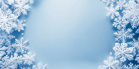 Frozen snowflakes border on blue background, ideal for winter greeting cards with ample copy space