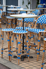 Vintage colourful bistro table and chairs set in outdoor cafe, used for breakfast, lunch and dinner on terrace, France