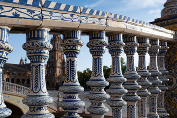 Fototapeta premium Old historical Andalusian town Seville, Spain. View on architectural details and ceramic tiles of buidings. Summer in Andalusia.