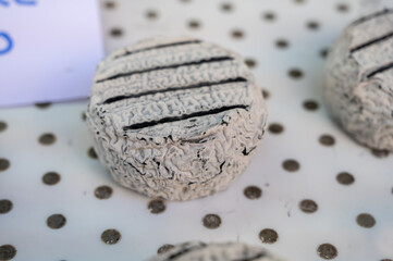 Cheese collection, French Cendre Lait cru Chevre cheese made from goat milk with ash in Souillac, Perigord region in France