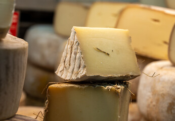 Farmer shop in Biarritz, France, Basque Country and Pyrenees sheep, cow and goat cheeses for sale, Tomme, Fermier Brebis, farmers cheese, close up