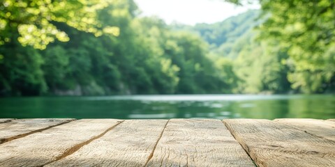Serene wooden pier overlooking a tranquil river surrounded by lush green trees.