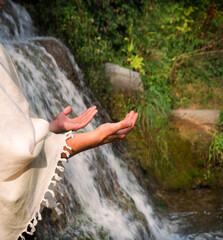 Praying man at the river