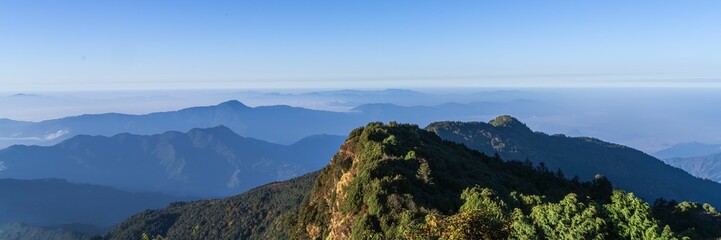 Scenic mountain view with clear blue sky.