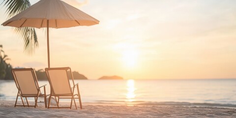 Obraz premium Beach chairs under umbrella at sunset, calm ocean view.
