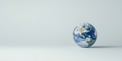 Fototapeta premium Earth globe on smooth background, symbolizing global awareness and environmental concerns.