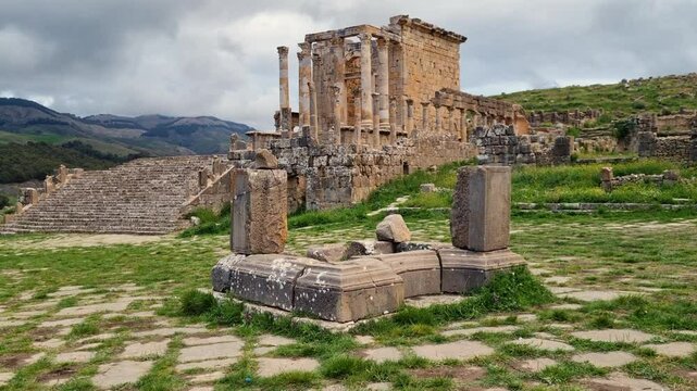 Revealing shot of Roman Severan temple ruins in Djemila Algeria on a cloudy day