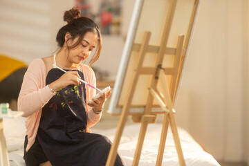 Woman Painting at Home Studio