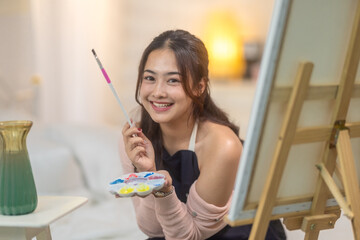 Woman Painting at Home Studio