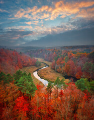 Autumnal landscape of the forest and twisted Radunia river in Kashubia. Poland