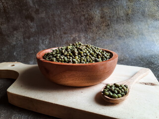 Close up mung beans in a wooden bowl.