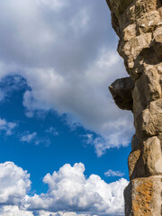 Ancient roman wall with clouds as background