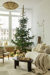 Cozy Christmas living room with a minimalistic decorated tree, soft knit blankets, and wrapped presents. Warm and inviting, perfect for capturing the essence of holiday comfort and simplicity.
