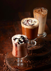 Coffee and chocolate drinks with whipped cream.