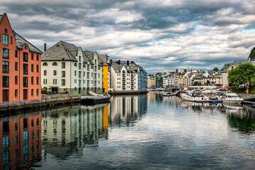 Fototapeta premium Canal with boats, old buildings in beautiful Alesund city in Norway
