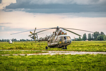 Fototapeta premium Old military helicopter at airbase field