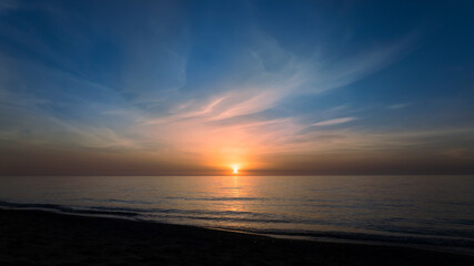 Calm sea in the evening silence in orange tones, relax