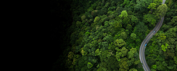 Road in the middle of the forest Concept of using electric cars to protect the environment and transportation , Adventure morning road trip in the forest © Hand Robot