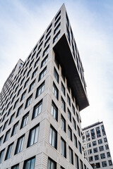 Modern Urban Architecture Showcased Among Tall Buildings Beneath a Blue Sky