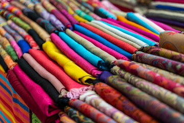 A Colorful Collection of Beautifully Rolled Textiles Arranged in a Vibrant Market Display