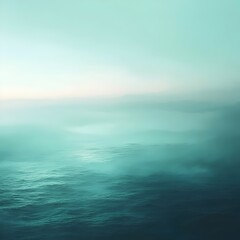 Obraz premium A serene and ethereal seascape featuring an expansive ocean, with soft teal hues blending into the sky, creating a tranquil and calm atmosphere.
