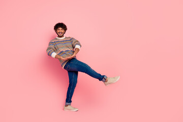 Full size photo of nice young man chilling dancing wear pullover isolated on pink color background