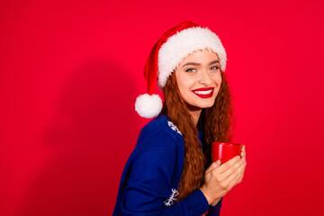 Photo of pretty young girl hold coffee mug wear trendy blue christmas outfit masquerade theme party on red color background