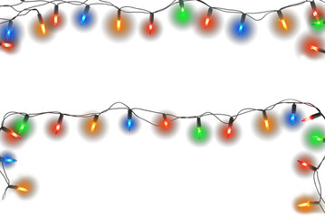 Christmas lights string isolated on white background. Border of festive colorful holiday light string isolated on white.